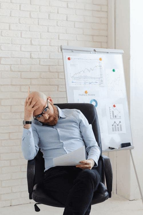 Finance manager reviewing printed performance charts